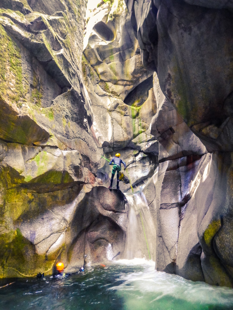 Chris entering the awesome pool at the end of the seventh rappel.